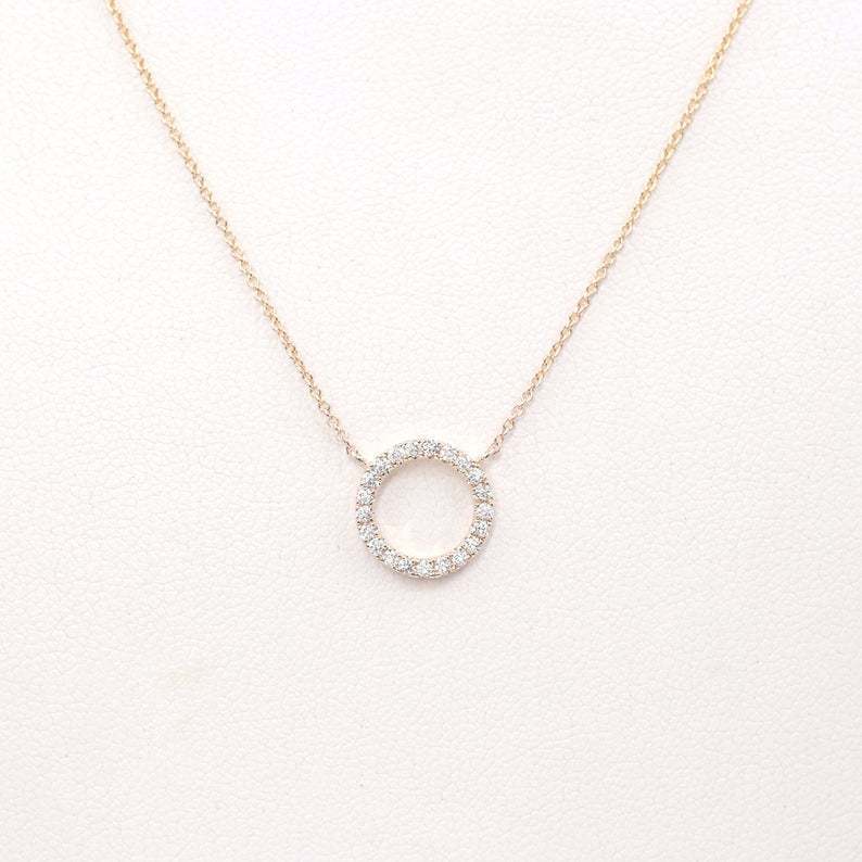 Geometric circular ring with diamond inlay and bangle chain for the collarbone