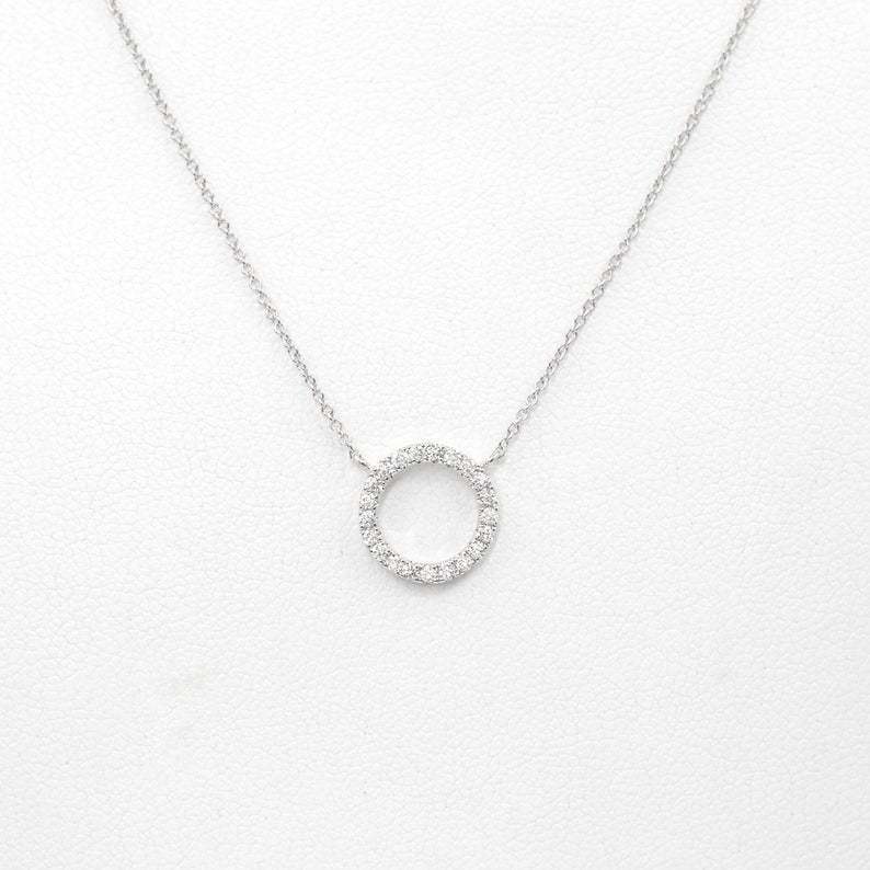 Geometric circular ring with diamond inlay and bangle chain for the collarbone